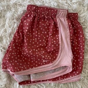 Nike Dri-Fit women’s star running workout shorts. Color: Light Pink &Dusty-Rose